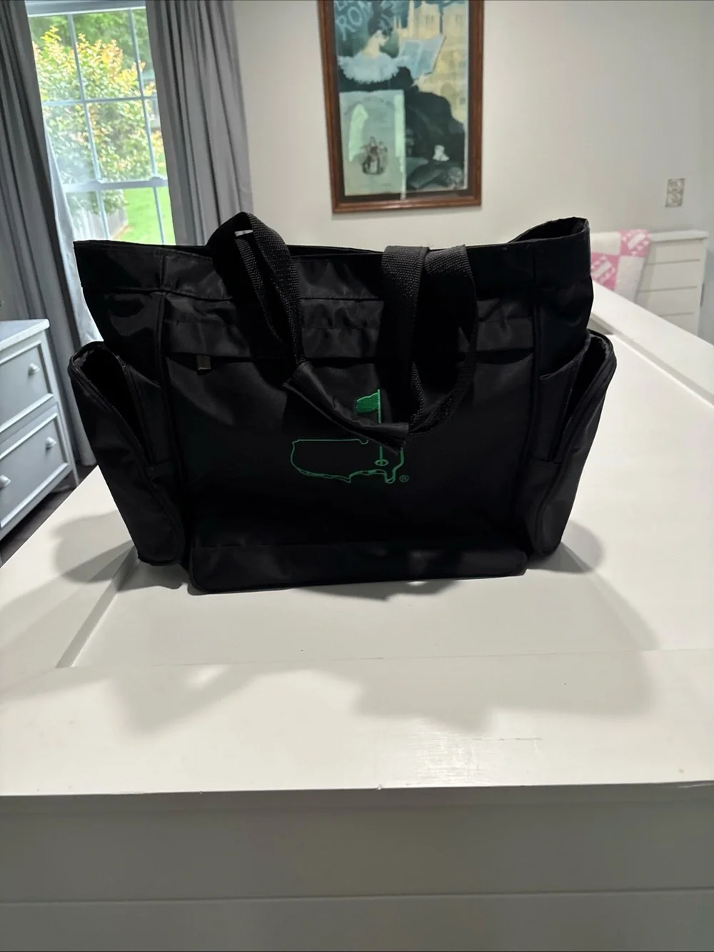 The Master’s officially licensed Black Tote Bag with Green Golf Flag Logo